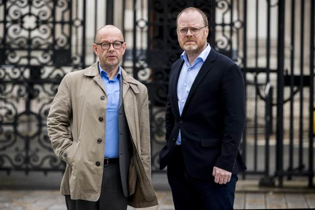 Barry McCaffrey (left) and Trevor Birney standing outside Belfast High Court
