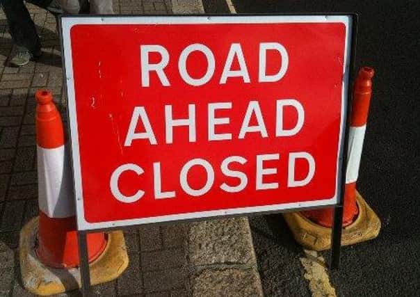 The road remains closed
