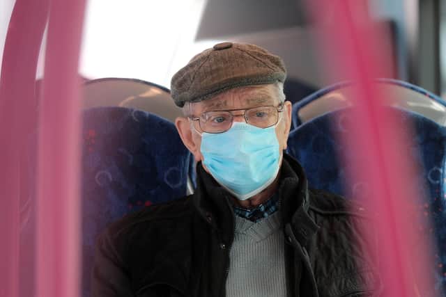 A passenger wearing a protective face mask on board a bus in Belfast. PICTURE BY STEPHEN DAVISON