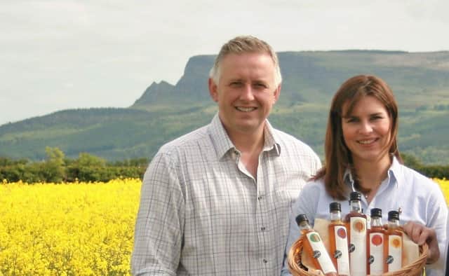 Richard and Leona Kane of Broglasco Farm in colourful fields of oilseed rape at Myroe in Co Derry