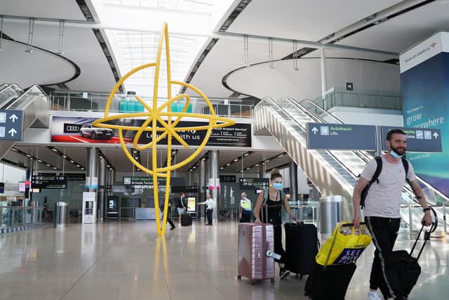 Travellers arrive in Dublin Airport.