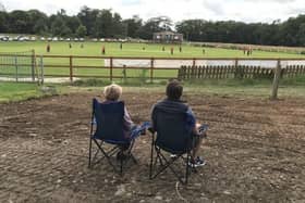 Alistair Bushe and his mother Joan watching the return of NCU cricket at The Lawn on Saturday