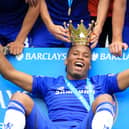 File photo dated 24-05-2015 of Chelsea's Didier Drogba celebrating with the lid of the Premier League trophy after the Barclays Premier League match at Stamford Bridge, London.