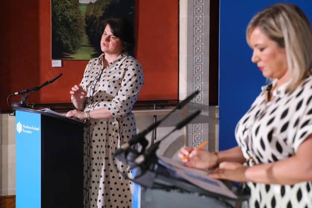 First Minister Arlene Foster (left) and deputy First Minister pictured during one of their last media briefings.