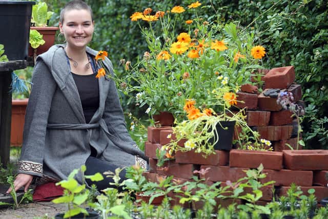 Esther Tolburn with her dog Daisy in the garden of her home in the Ravenhill area of Belfast. Esther is developing a permaculture of trees and plants which is intended to be sustainable and self-sufficient.
PICTURE BY STEPHEN DAVISON