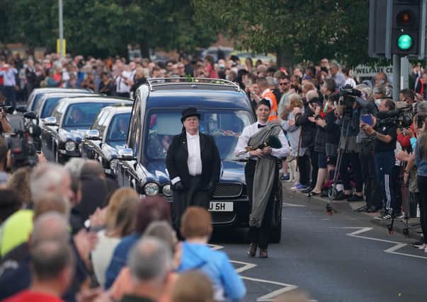 People line the streets as the funeral cortege of Jack Charlton passes through his hometown of Ashington, in Northumberland ahead of his funeral service at West Road Crematorium, in Newcastle.