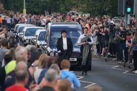People line the streets as the funeral cortege of Jack Charlton passes through his hometown of Ashington, in Northumberland ahead of his funeral service at West Road Crematorium, in Newcastle