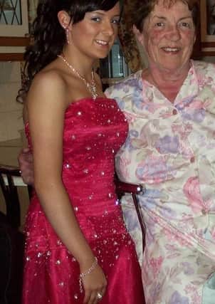 Rachael Finaly wearing the formal dress, with her late grandmother Carrie Finlay