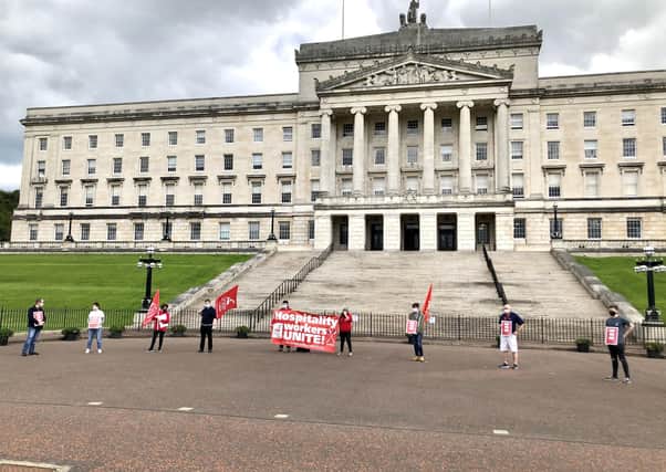 Unite union protest outside Parliament Buildings, Belfast. Hospitality workers have voiced concerns about employers using the job retention scheme to make "opportunist lay-offs" and pay wages during statutory notice periods