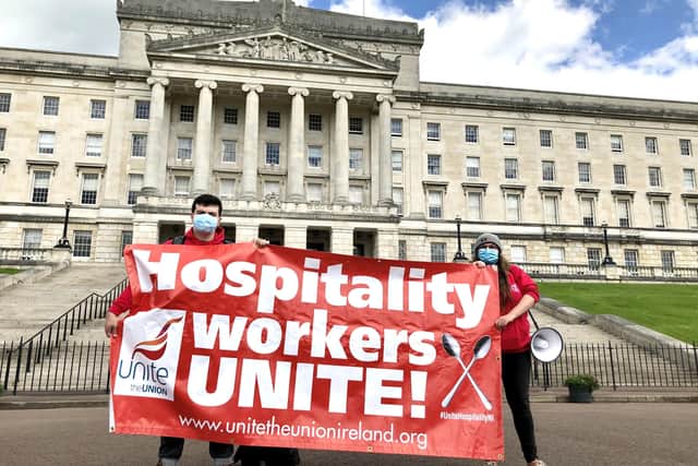 Unite union protest outside Parliament Buildings, Belfast. Hospitality workers have voiced concerns about employers using the job retention scheme to make "opportunist lay-offs" and pay wages during statutory notice periods
