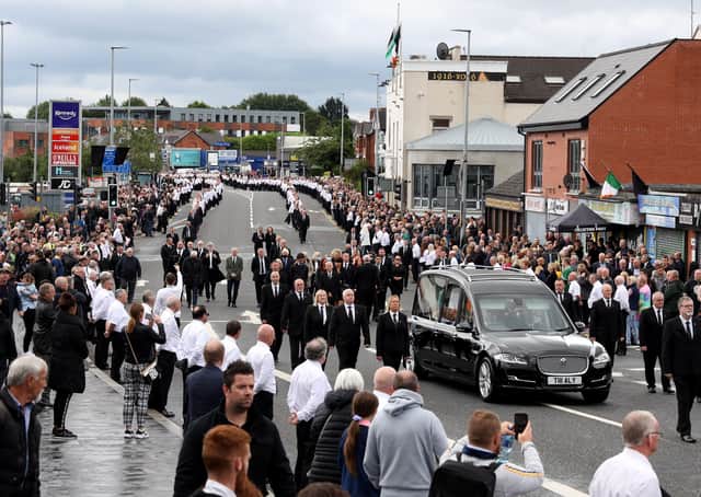 Bobby Storey's funeral in west Belfast, before his coffin was taken to Roselawn