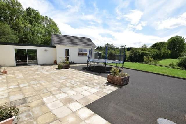 Outside features include stunning countryside views to the rear and a large patio to rear