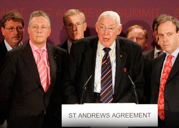 Ian Paisley and senior members of the DUP at St Andrews in Scotland in 2006 after the deal. The party made constraints on ministers one of its centre-piece demands for the restoration of Stormont, yet now, under a different leadership, it is helping to push through legislation that will remove those constraints