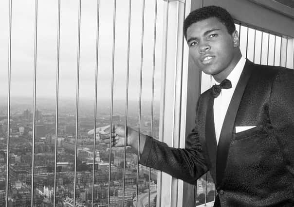 World heavyweight champion Muhammad Ali looking down on the London scene from the 600-foot high GPO Tower in London's Howland Street during 1966. Pic by PA.