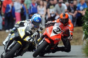 Keith Amor (24) and Ryan Farquhar (77) had a fierce rivalry at the Irish national road races.