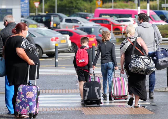 Passengers traveling on a flight from Malaga, in Spain,  pictured arriving at Belfast International Airport on Sunday morning. Picture by Jonathan Porter/PressEye