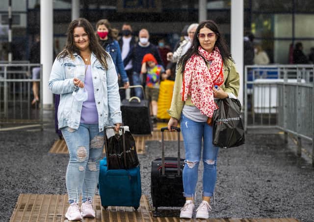 Aleksanda Sabalina (left) and Edith Mikutenaite who live in Newtownabbey leaving Belfast International Airport after arriving on Easyjet's 10am EJU6672 flight from Barcelona, Spain.  Picture: PA