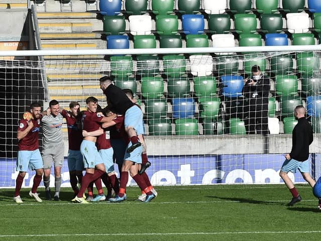 Ballymena Unite players celebrate as Ben Doherty misses the crucial penalty