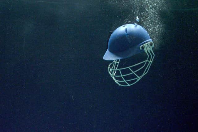 Cricket helmet sinking in water