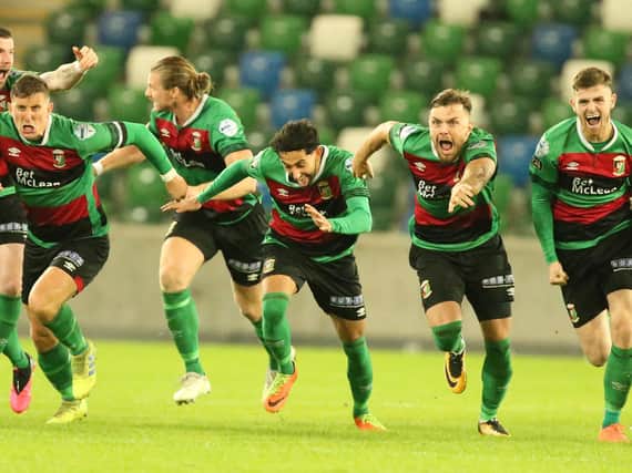 Glentoran players celebrate their penalty shoot-out win over Cliftonville