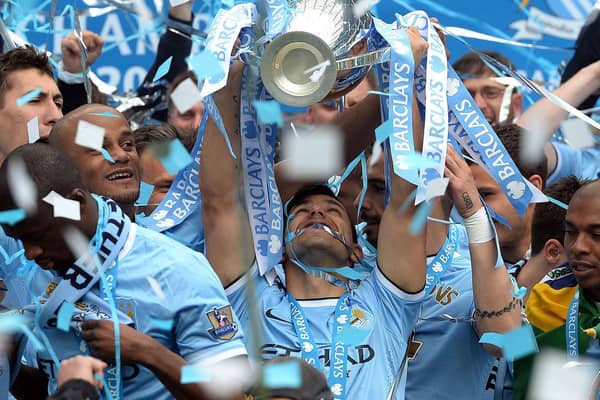 Sergio Aguero lifts the Premier League trophy