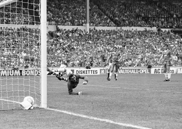 Norman Whiteside (partially obscured centre) scores the winning goal against Everton in the 1985 FA Cup final