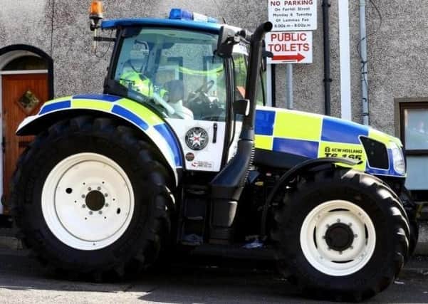 A PSNI livery tractor at the Lammas Fair in Ballycastle