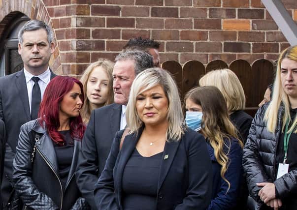 Sinn Fein finance minister Conor Murphy seen standing behind Deputy First Minister Michelle O'Neill during the funeral of the senior IRA man Bobby Storey at St Agnes' Church in west Belfast on June 30. He says his ministerial car stopped off there on his way to his Newry and Armagh constituency