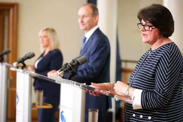 From left to right, deputy First Minister Michelle O'Neill, Taoiseach Micheal Martin and First Minister Arlene Foster at a press confrerence at Dublin Castle.