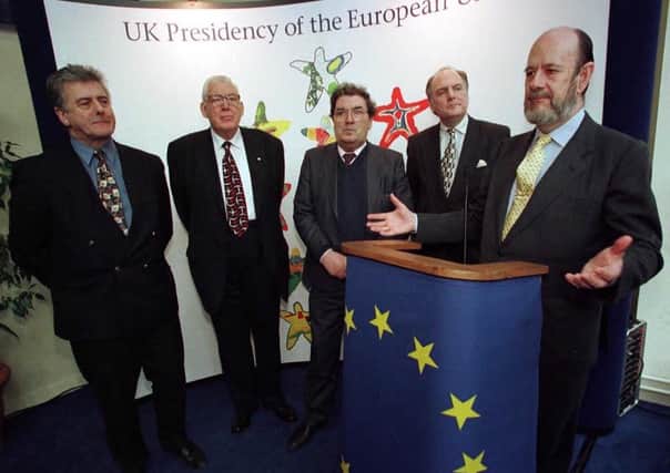 John Hume, centre, in 1998 with fellow MEPs Jim Nicholson, left, and Ian Paisley. The trio worked together to get funds for Northern Ireland, and are seen above at an event to discuss such funding, with Jim Dougal, Head of Representation for EU in NI and the President of the European Parliament, right, Jose  Maria Gil-Robles (AP Photo/Paul McErlane)