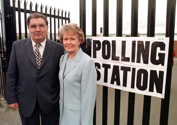 SDLP leader John Hume with his wife Pat vote in Londonderry in the Good Friday referendum in 1998