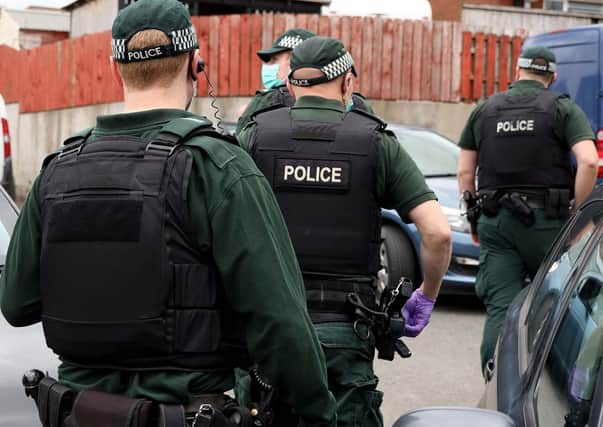 PSNI officers carrying out searches as part of Operation Venetic