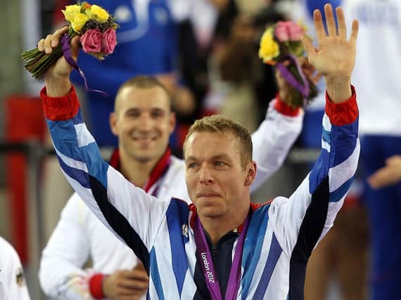 Sir Chris Hoy with his Gold Medal won in the Men's Team Sprint at the Velodrome, London.