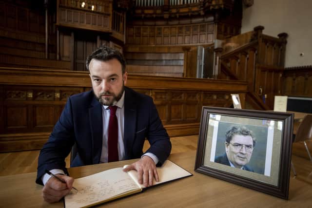 Leader of the SDLP Colum Eastwood, signing the book of condolence at Guildhall in Londonderry to his former leader John Hume. The Former SDLP leader, who was one of the key architects of peace in Northern Ireland, died at the age of 83.