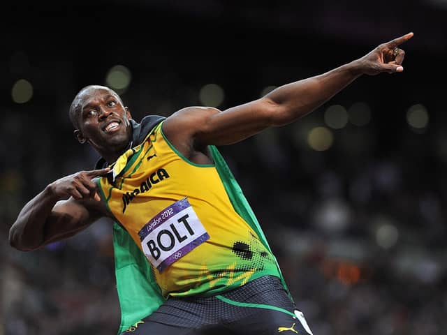 Jamaica's Usain Bolt celebrates winning the Men's 100m final at the Olympic Stadium, London