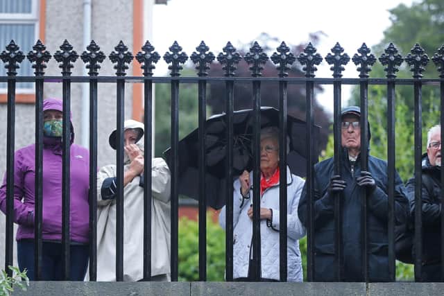 Members of the public gather outside St Eugene's Cathedral in Londonderry, where the coffin of John Hume is taken into, ahead of his funeral on Wednesday. Photo credit: Niall Carson/PA Wire