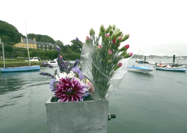 Flowers left at Strangford harbour on Wednesday in memory of Brian Black