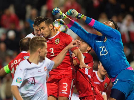 Gibraltar's goalkeeper Dayle Coleing (Top R) during the Euro 2020 Group D qualification football match between Gibraltar and Switzerland