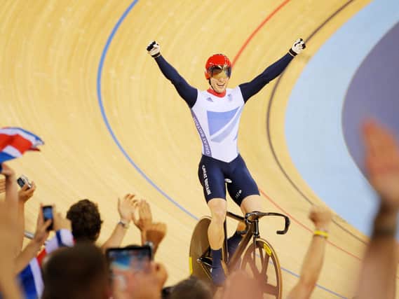Great Britain's Jason Kenny celebrates winning the Gold Medal after winning the Men's Sprint Final Race 2 against France's Gregory Bauge at the Velodrome in the Olympic Park