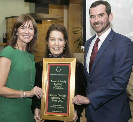 Jennie and Ronan Sweeney of Balloo House Group receiving their prestigious award from Irish food expert Georgina Campbell