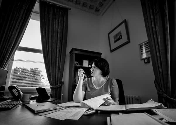 Arlene Foster pictured at her desk in Stormont