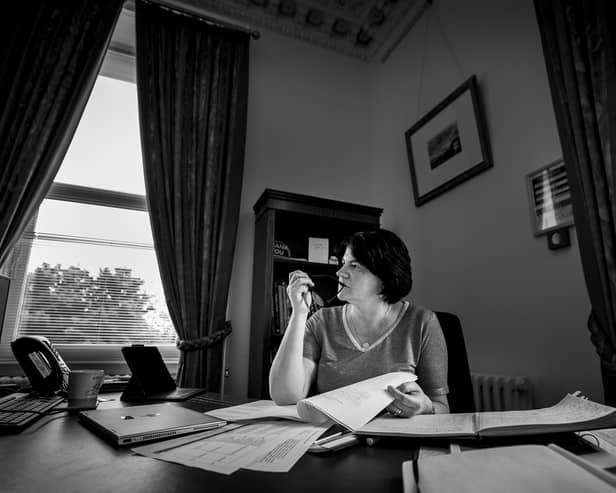Arlene Foster pictured at her desk in Stormont