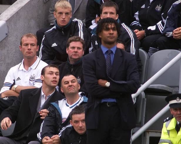 Newcastle United's Alan Shearer can only watch from the stand with manager Ruud Gullit after he was sent off