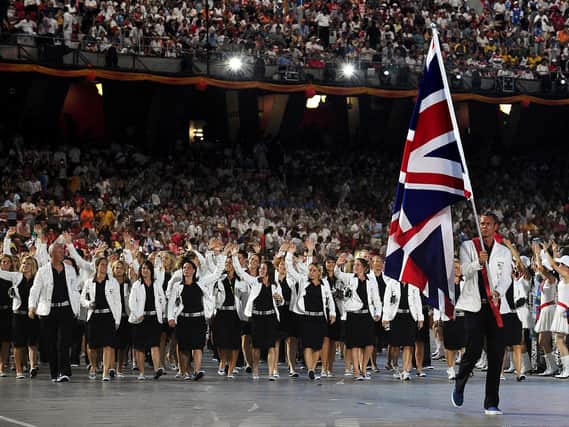 Great Britain's Flag Carrier Mark Foster leads the team out during the Beijing Olympic Games 2008 Opening Ceremony at the National Stadium in Beijing
