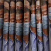 Copies of Apple Daily newspaper with front pages featuring Hong Kong media tycoon Jimmy Lai, are displayed for sale at a newsstand in Hong Kong, Tuesday, Aug. 11, 2020. Hong Kong police have arrested Lai and raided the publisher's headquarters, broadening their enforcement of a new security law (AP Photo/Kin Cheung)