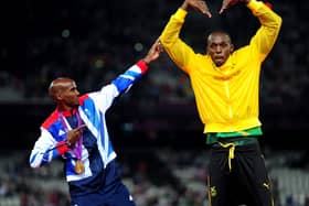 File photo dated 11-08-2012 of Great Britain's Mo Farah celebrating with Usain Bolt victory in the Men's 5000m final on day fifteen of the London Olympic Games in the Olympic Stadium, London.