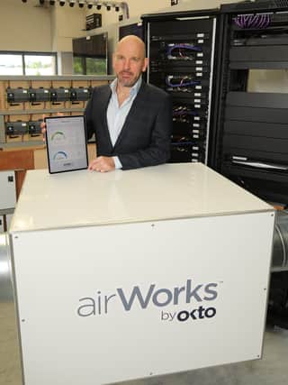 Philip Dowds, Managing Director of OKTO Technologies is pictured with the largest in the range of filters and the OKTOair dashboard