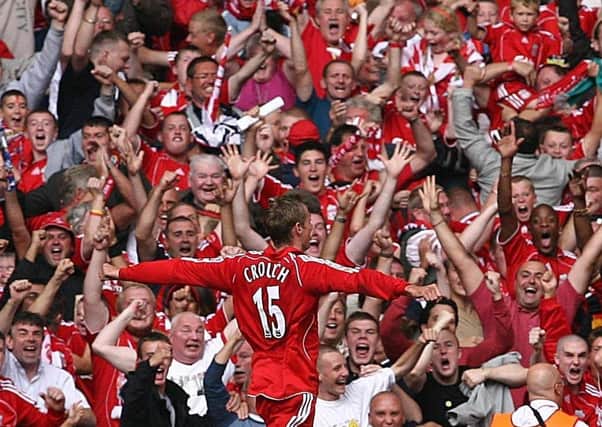 File photo dated 13-08-2006 of Liverpool's Peter Crouch celebrating in front of the Liverpool fans after scoring against Chelsea during the FA Community Shield at Millennium Stadium, Cardiff.