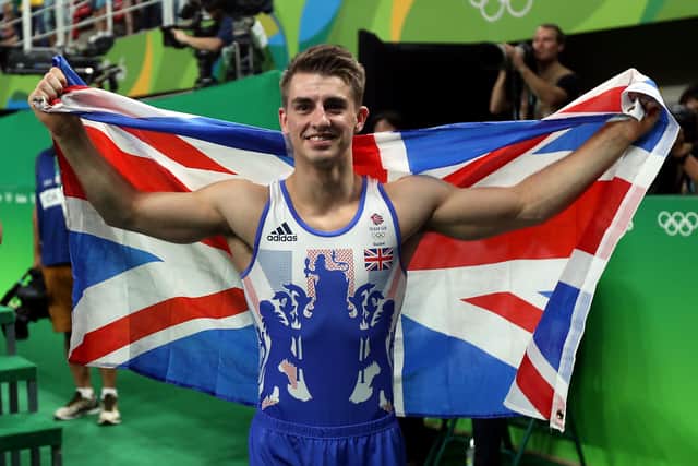 Great Britain's Max Whitlock celebrates winning a gold medal following victory on the floor apparatus on the ninth day of the Rio Olympics Games, Brazil in 2016.