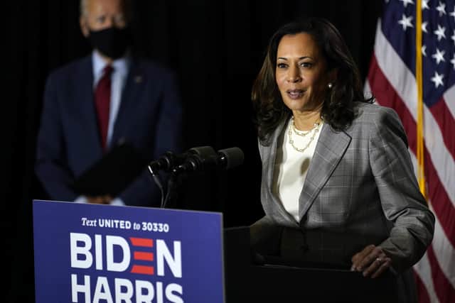 Democratic presidential candidate Joe Biden looks on as his running mate Sen Kamala Harris, speaks at the Hotel DuPont in Wilmington, Del. AP Photo/Carolyn Kaster